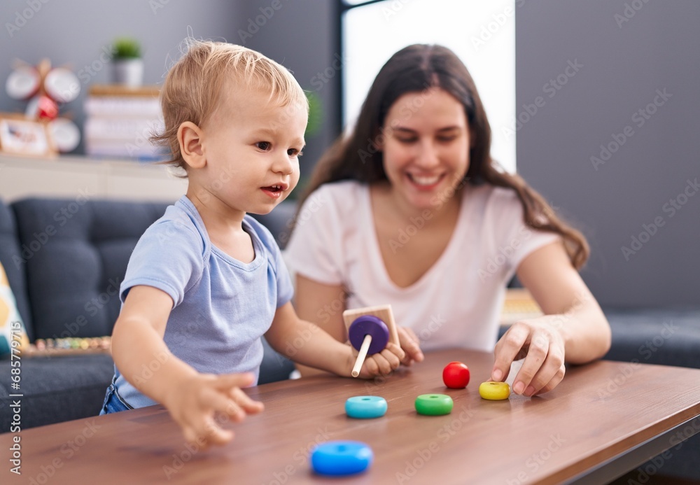 Mother and son smiling confident playing at home Mother and son smiling confident playing at home
