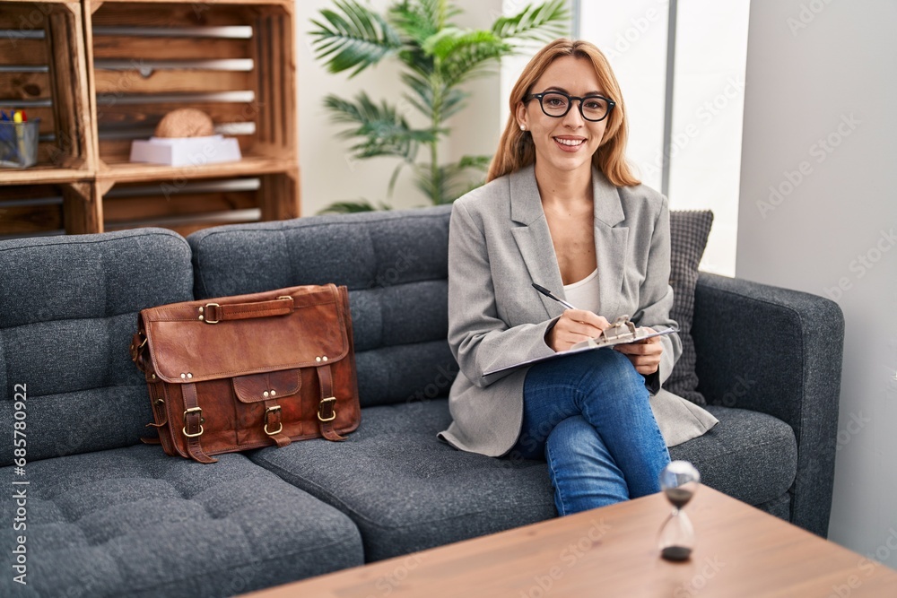 Hispanic woman working at consultation office with a happy and cool smile on face. lucky person. Hispanic woman working at consultation office with a happy and cool smile on face. lucky person.