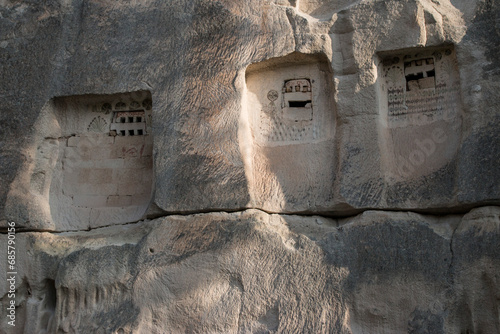 rows of pigeon houses, carved in volcanic cliff in Rose Valley, Cappadocia, Turkey