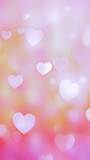 St. Valentine's day background - a collection of red and pink hearts of varying sizes and shades, floating on a blurred, with bokeh effect background. Dreamy and romantic feel.	
