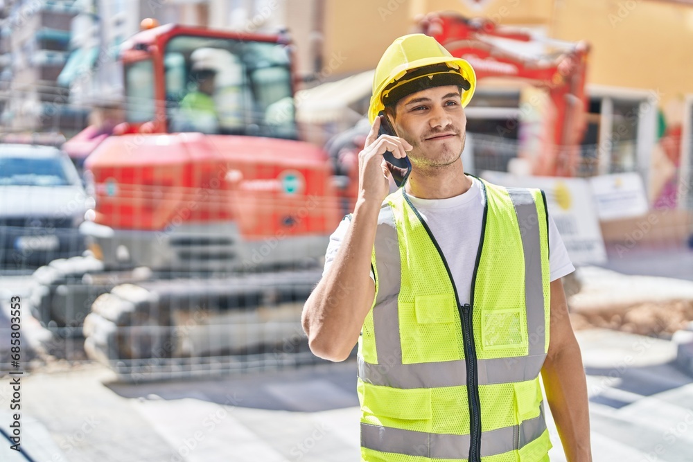 Young hispanic man architect smiling confident talking on smartphone at park Young hispanic man architect smiling confident talking on smartphone at park