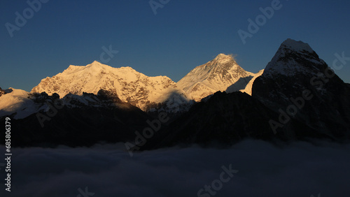 Snow covered Chumbu and Mount Everest just before sunset.
