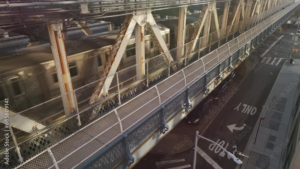 Drone shot of the subway passing over the Manhattan Bridge at during the morning rush hour Drone shot of the subway passing over the Manhattan Bridge at during the morning rush hour