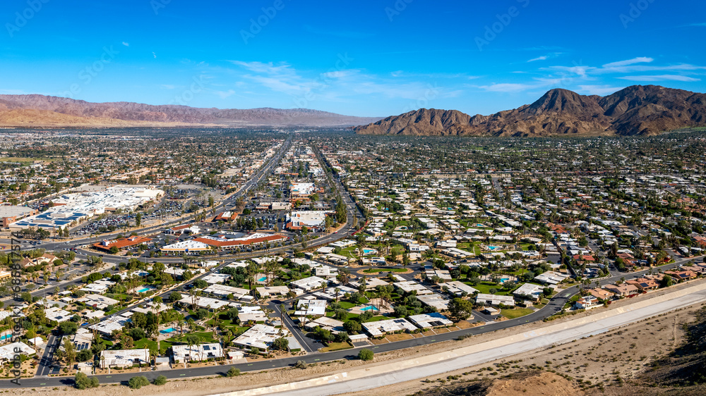 Aerial panoramic view of Palm Desert resort communities and mountains
