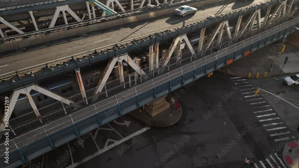 Drone shot of the subway passing over the Manhattan Bridge at during the morning rush hour Drone shot of the subway passing over the Manhattan Bridge at during the morning rush hour
