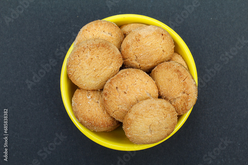 Osmania biscuits in a bowl on black background top view  photo
