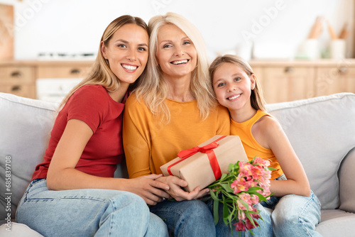Happy family with presents and smiles, home interior
