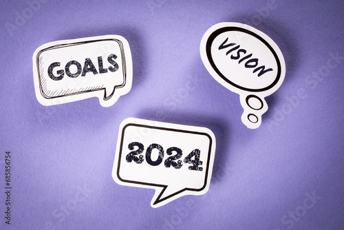 2024 Goals and Vision concept. Speech bubbles on purple background
