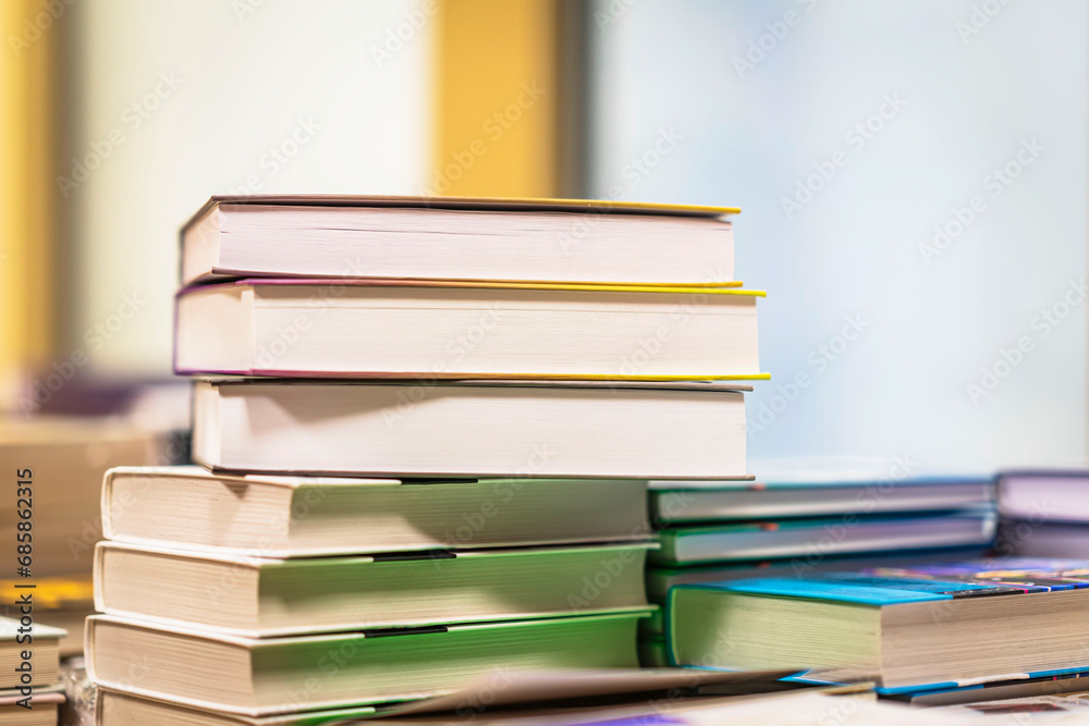 Fototapeta premium Pile of books on table. Education, school, reading concept