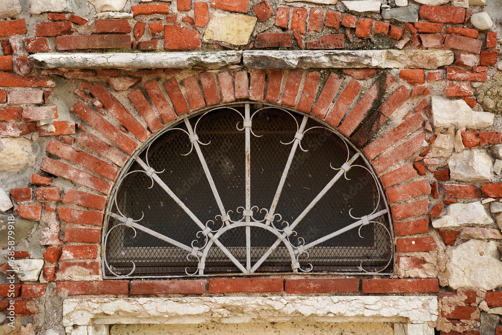 The pattern of an ancient Italian wall with an old window. The pattern of an ancient Italian wall with an old window.