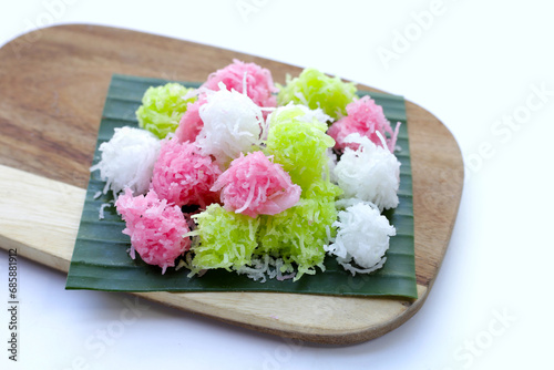 Sweet coconut balls, crispy coconut candies (Maprao Gaew). Thai traditional dessert photo