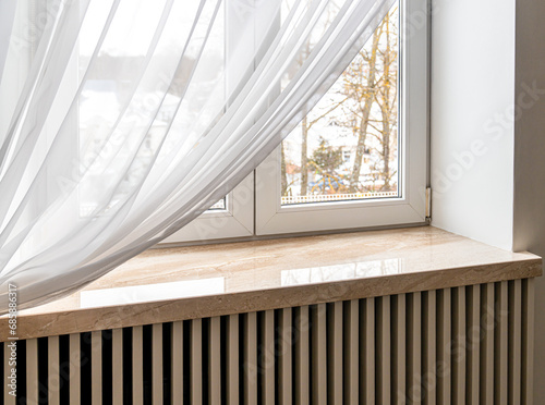 Modern window sill made of marble stone. Close-up shot
