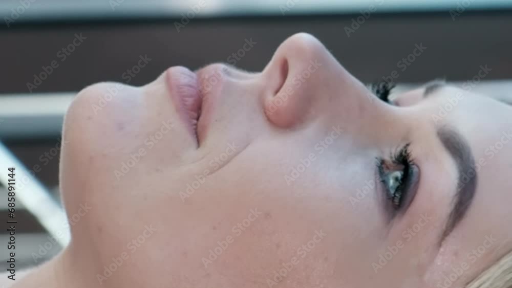 Portrait of a beautiful blonde, close-up. Vertical video Portrait of a beautiful blonde, close-up. Vertical video