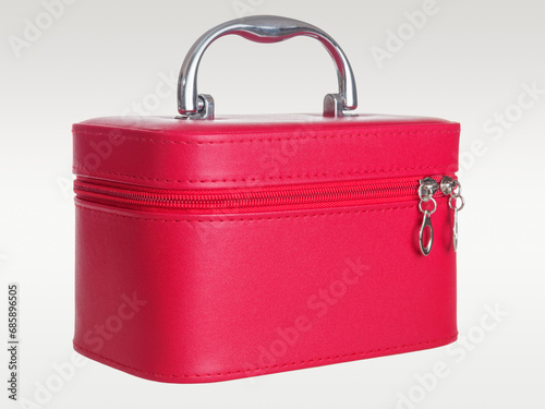 Red leather chest bag case with handle isolated on background