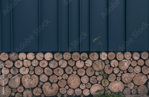 Close up of wall with textures of tree's cuts and gray steel sheet. Gray vertical lines steel siding realistic texture. Dark metal striped roof sheet, seamless pattern.  
Seamed metal roof textures