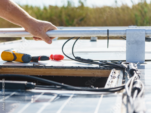 RV solar panel installation. Caravan roof repair photo