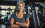 Happy nice mature woman in a gym.