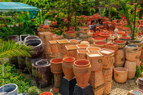 Clay products from pottery production. Background with selective focus and copy space © Iurii Gagarin