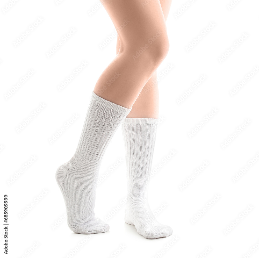 Legs of young woman in socks on white background Legs of young woman in socks on white background