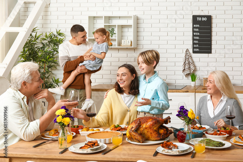 Happy family having dinner ...