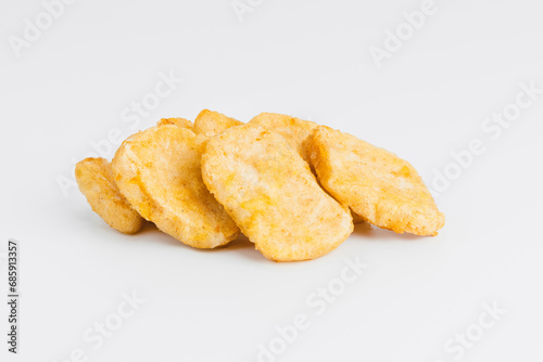 Breaded Chicken Inner Fillet on a White Background,Chicken Breaded Raw Meat.Chicken Breaded Fillet.Fast food. Fast cooking. Breaded chicken nuggets. Homemade food at home.