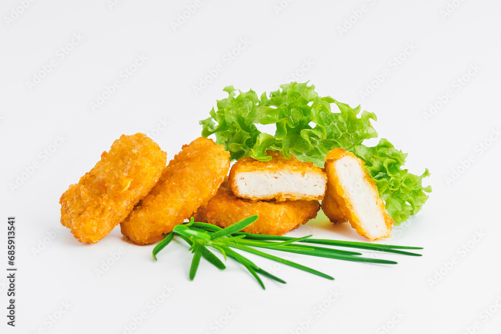 Breaded chicken nuggets.Breaded Chicken Inner Fillet with green lettuce leaves on a White Background.Chicken Breaded Raw Meat,Fillet.Fast homemade food at home. Chicken breaded schnitzels.Fast cooking Breaded chicken nuggets.Breaded Chicken Inner Fillet with green lettuce leaves on a White Background.Chicken Breaded Raw Meat,Fillet.Fast homemade food at home. Chicken breaded schnitzels.Fast cooking