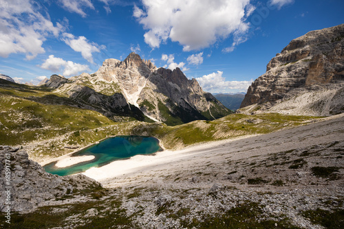 Fototapeta Naklejka Na Ścianę i Meble -  Spectacular scene of small serene natural lakes Bodenseen under summer sun surrounded by greenery and rocky mountains in Sexten Dolomites in South Tyrol, Italy