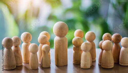 Group of diverse wooden figurines in a line  symbolizing unity  teamwork  and community in social gatherings  isolated on a wooden table background with Christmas decorations