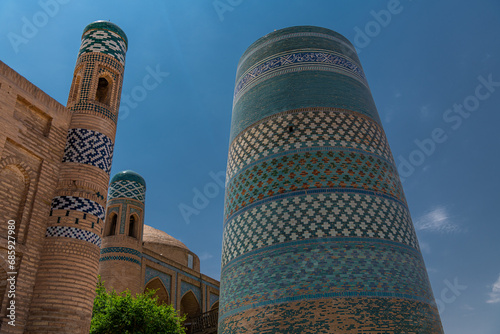 Minaret kalta minor and Muhammad amin khan madrasah in Khiva, Uzbekistan. photo
