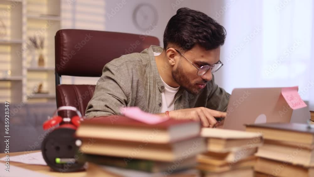 Worried young man student with crossed fingers while get notification email and feeling upset reading bad negative news message exam result at home Disappointment concept Worried young man student with crossed fingers while get notification email and feeling upset reading bad negative news message exam result at home Disappointment concept