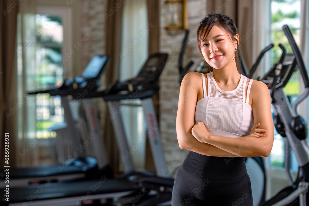 Happy sport beautiful young asian woman exercise workout smile training at the gym fitness. athlete girl training strong and good health and strength.