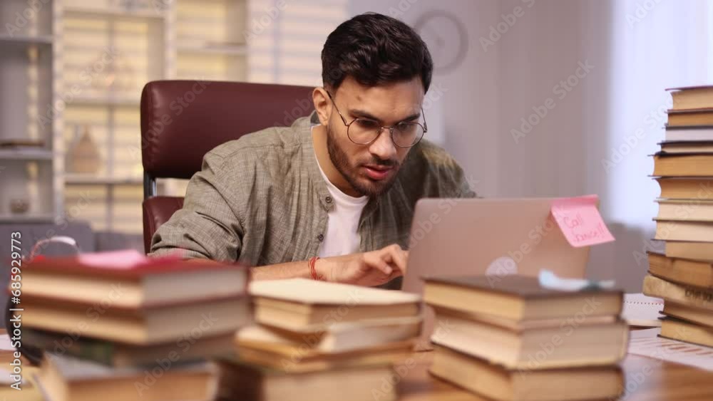 Portrait of amazed young man student got notification message and looking at screen with puzzled face at home Shocked handsome male reacting to news and feel confused next to laptop indoors Portrait of amazed young man student got notification message and looking at screen with puzzled face at home Shocked handsome male reacting to news and feel confused next to laptop indoors