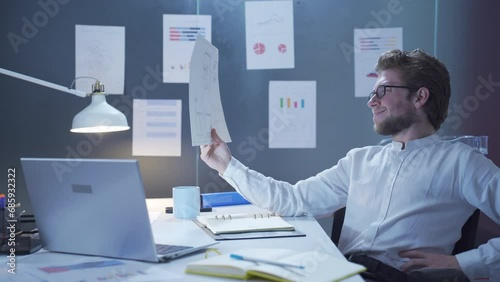 Happy businessman looking at the project.