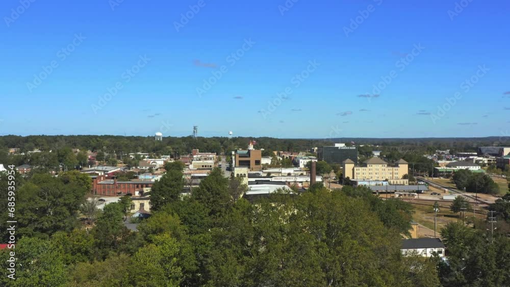 Aerial drone shot over Tupelo, Mississippi, featuring historic buildings, tree-lined streets, and clear skies, capturing the essence of the small town. Aerial drone shot over Tupelo, Mississippi, featuring historic buildings, tree-lined streets, and clear skies, capturing the essence of the small town.