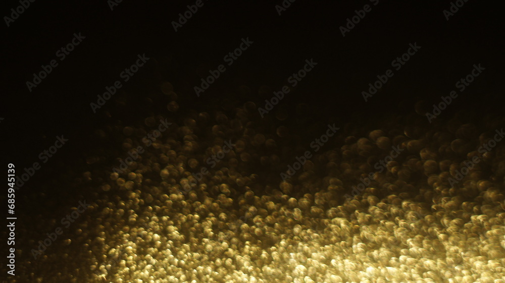 Golden Glitter Bokeh - Radiant and Shimmering Light Effects, Ideal for Adding a Touch of Luxury and Sparkle to Various Creative Projects.