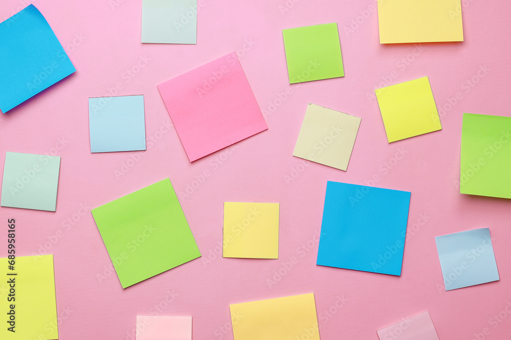 Blank multicolor sticky notes on pink background. Blank multicolor sticky notes on pink background.