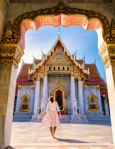 Wat Benchamabophit temple in Bangkok Thailand, The Marble temple in Bangkok. Asian woman with hat visiting temple in Bangkok © Fokke Baarssen