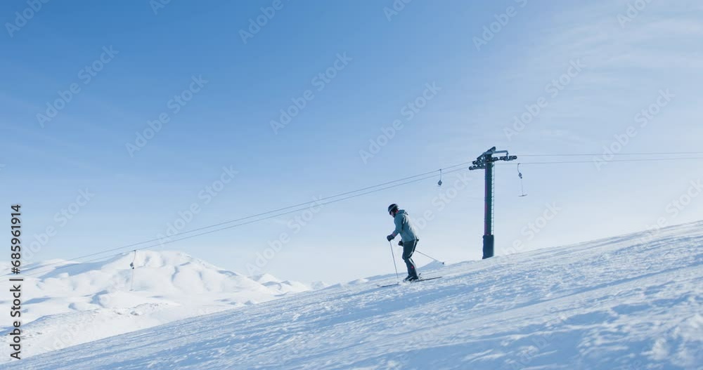 Experienced male skier skiing on slopes on a ski center. Recorded at 120 fps. Experienced male skier skiing on slopes on a ski center. Recorded at 120 fps.
