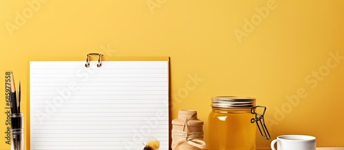 Notepad with honey do list and tools on desk. photo