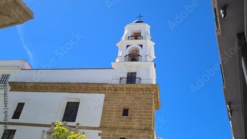 Bell Tower on Plaza San Agustín in Cadiz, Spain, Authentic Architecture on Sunny Day photo