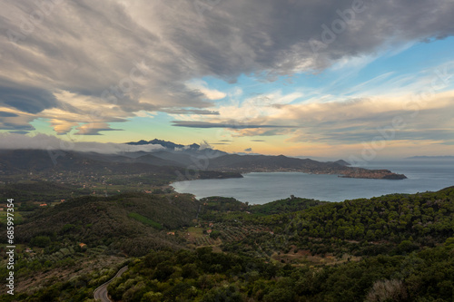 view of curvy mountain road and Portoferraio Bay on Elba Island at sunrise