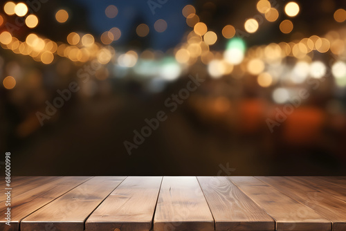 Wooden table top on blurred pub background with bokeh lights - mockup for product display or montage