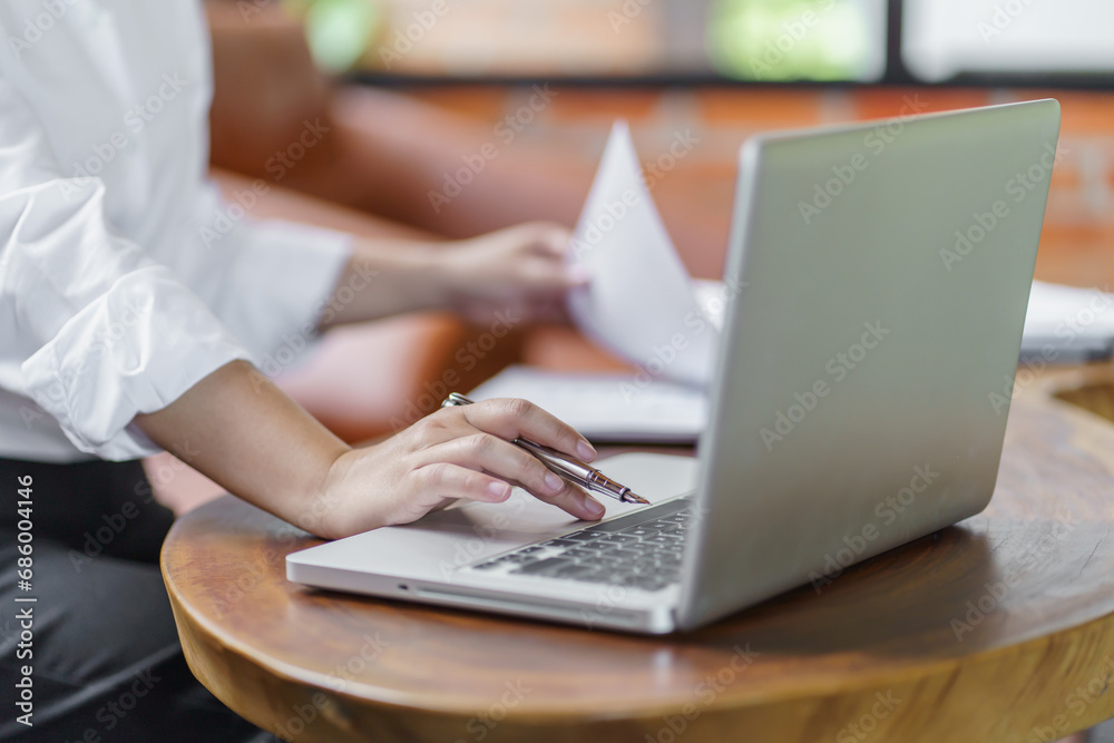 Happy young Asian Woman working on computer Business Data Analyst. Happy young Asian Woman working on computer Business Data Analyst.