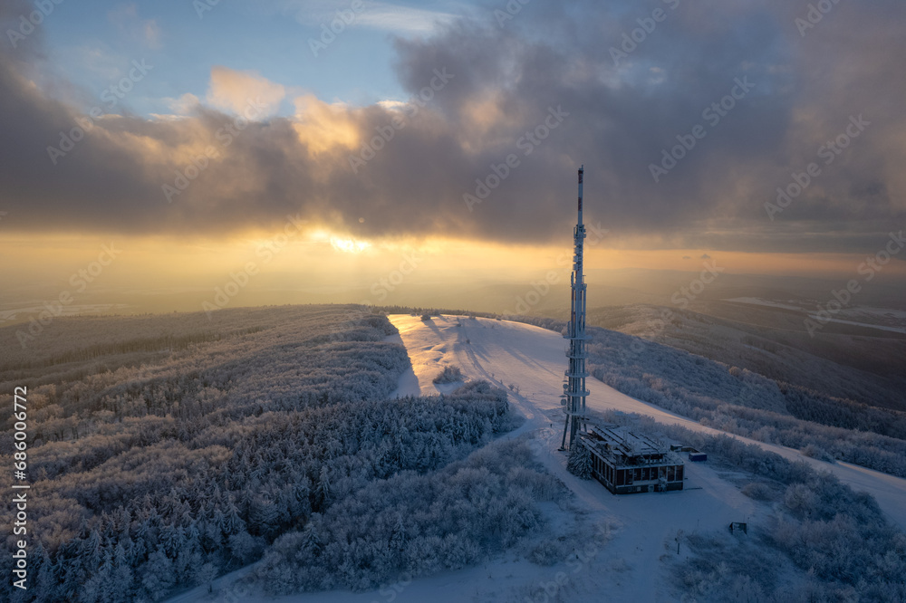 Winter photos of the highest mountain of the White Carpathians. Big Javorina. Transmitter on the kopje at sunset. 