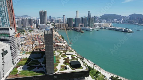 West Kowloon Cultural Area, A Waterfront Leisure Promenade Palace Museum Freespace near Tsim Sha Tsui, Central, Victoria Harbour, Hong Kong in the background, Aerial drone skyview photo