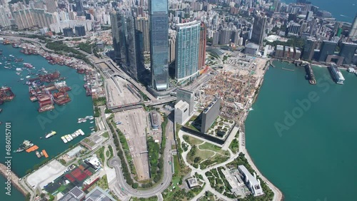 West Kowloon Cultural Area, A Waterfront Leisure Promenade Palace Museum Freespace near Tsim Sha Tsui, Central, Victoria Harbour, Hong Kong in the background, Aerial drone skyview photo