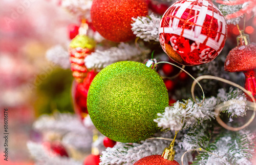 Christmas background-colored toys hang on the Christmas tree 