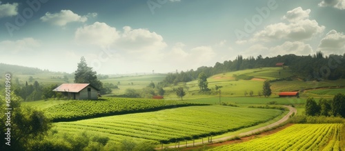 The beautiful landscape of the farm, with its lush green fields and vibrant leaf-covered trees, perfectly showcases the awe-inspiring beauty of nature and agriculture.