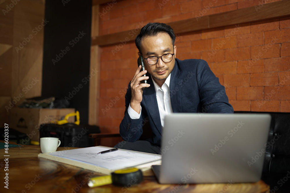 Young architect, engineer, male businessman with blueprint construction industry Young architect, engineer, male businessman with blueprint construction industry