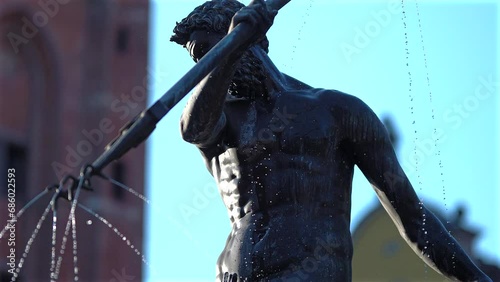 Close up shot of Neptune statue in the old town of Gdansk, Poland photo